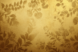 ゴールドの壁面に植物模様が浮かび上がる、アンティーク調でクラシックな装飾背景。