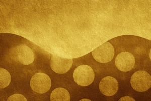 波打つラインの下部に大きなドット模様が浮かぶ、ゴールド調の抽象的な背景。