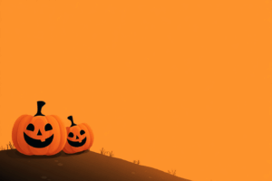 オレンジ色の空の下、緩やかな丘の上に並ぶ2つの笑顔のカボチャランタン。シンプルで温かみのあるハロウィンの情景